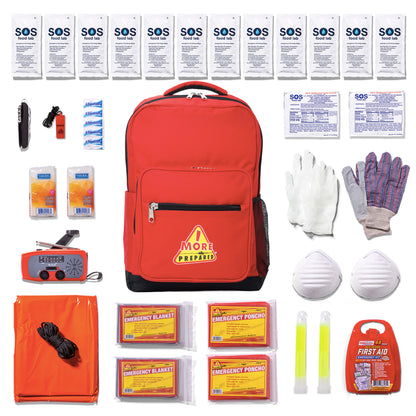 A red emergency preparedness backpack laid flat with various emergency and safety supplies arranged around it on a white background. The backpack has a yellow and red 'More Prepared' logo on the front pocket.
