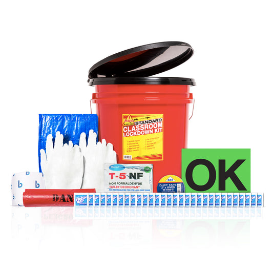 A classroom lockdown kit bundle displayed on a white background, featuring a red plastic bucket with a black lid, white gloves, a blue plastic bag, a red tape roll, a green 'OK' sign, and various other safety accessories.
