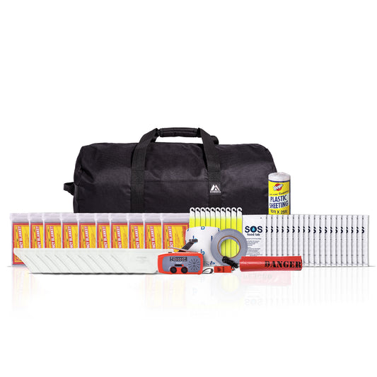 Emergency preparedness kit with a black duffel bag, first aid supplies, plastic water bottles, a can of plastic mulch, a roll of duct tape, a red/orange whistle, and other survival gear arranged on a white background.