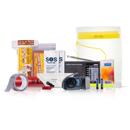 A survival and emergency preparedness kit arranged on a white reflective surface, including a yellow waterproof pouch, duct tape roll, SOS food lab water pouches, a radio with batteries, and other survival supplies.