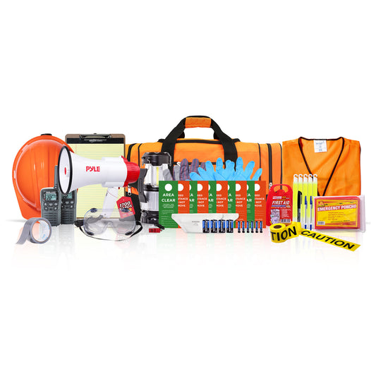 A comprehensive emergency preparedness and safety kit displayed on a clean white background. The kit includes an orange hard hat, a white and red Pyle megaphone, a walkie-talkie, clear safety glasses, a green and white first aid kit, multiple boxes of Pyle emergency batteries, blue gloves, a bright orange carrying bag, reflective caution tape, and other safety accessories.